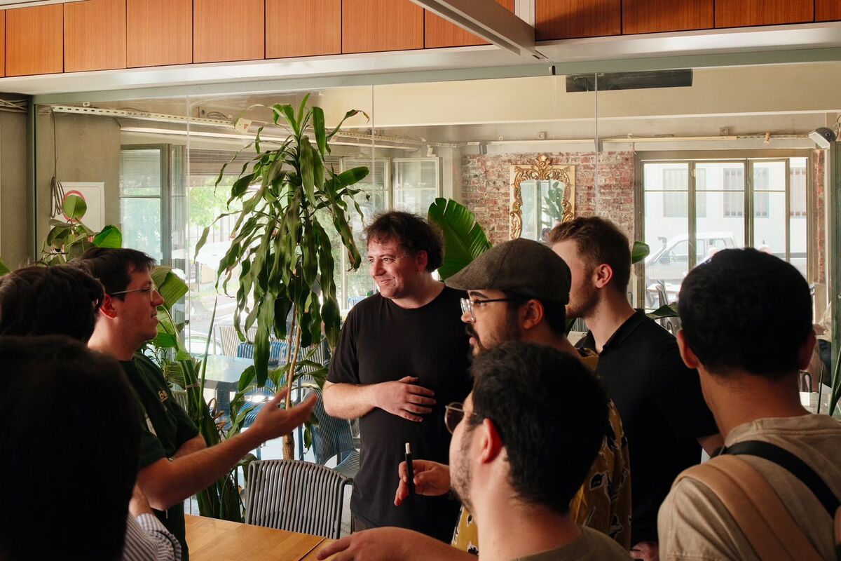 Builders talking in a plant filled venue
