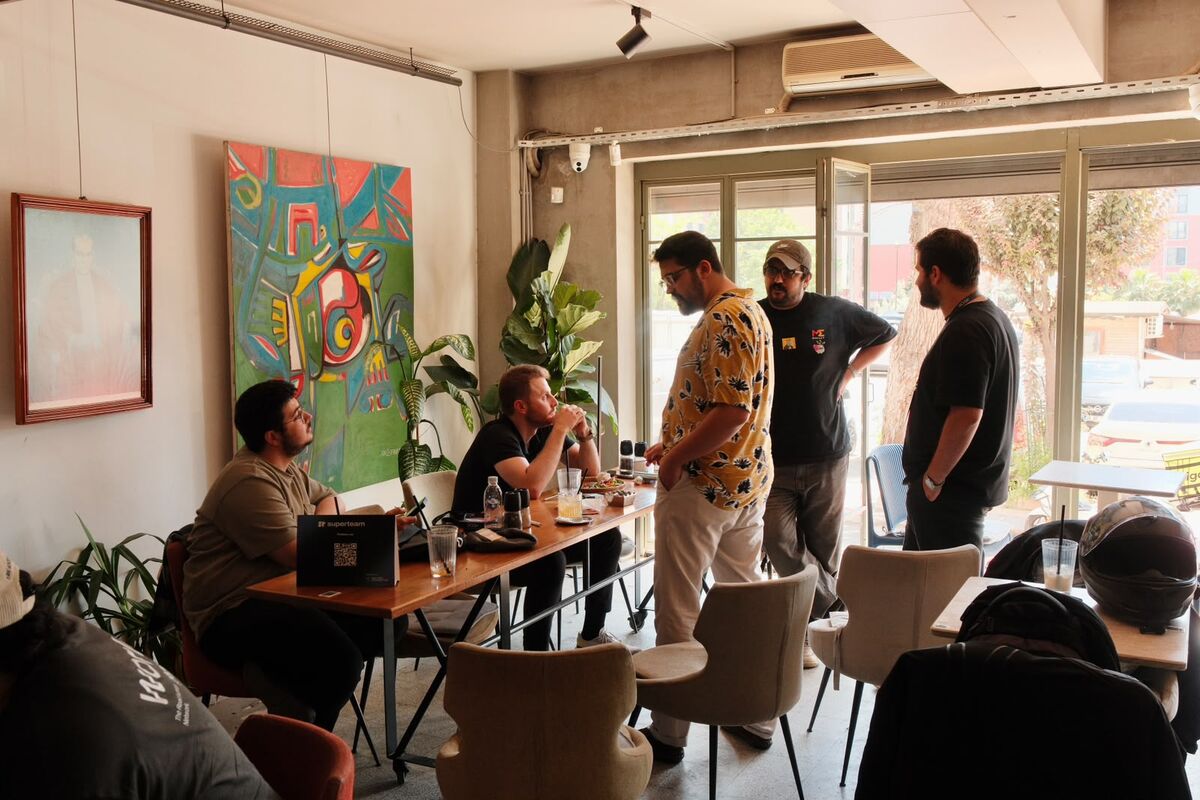 A seated group in conversation at the Build Station
